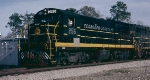 Seaboard Coast Line U18B #255, with the small fuel tank for branch line service, leading SCL train #330 thru the Southern Railway (Central of Georgia) interlocking 